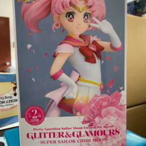 Boxed figure of Chibi Moon from Sailor Moon Eternal: pink-haired heroine in a white and pink sailor outfit with pink flowers on the box, Bandai product.