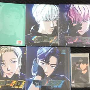 Six anime-style character card boxes arranged in two rows on a black surface, with a green-tinted left cover and blue/purple-toned portraits, plus a small plastic card sleeve on the right.
