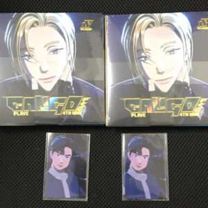 Two large boxed figures with a blond-haired anime character; next to each other on a dark surface, with gold logo text at bottom left.