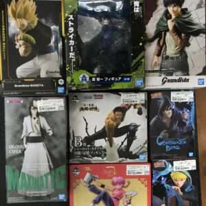 Collection of assorted boxed anime figures on a floor, featuring characters from Dragon Ball, Bleach, One Piece, and Naruto (Bandai Grandista lines).