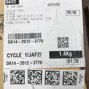 Shipping label on a package: date 04/22, Ground service, recipient Osamu Uehara in Tochigi-ken, weight 1.4 kg, with barcode and QR codes.