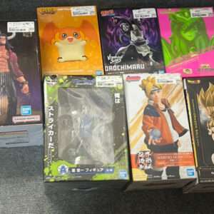 Row of boxed anime action figures on a carpeted floor, including Naruto and Dragon Ball boxes with various colorful designs.