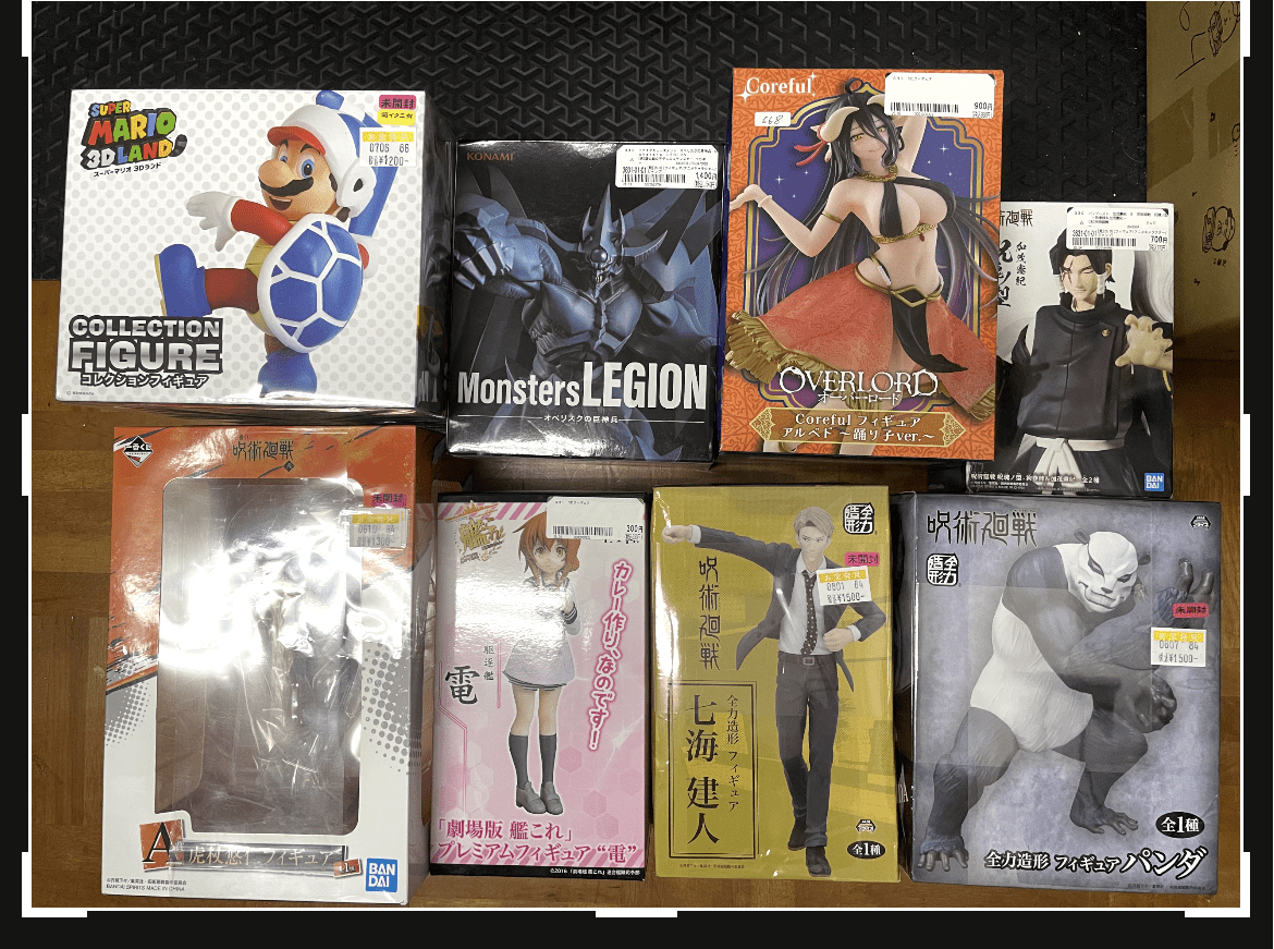 Ver Fotos Recientes 32 - Articulos Japan (post Box Japan) Assorted boxed anime figures arranged on a wooden floor, including Mario, Batman, Overlord, and other characters ready for display or sale Articulos Japan (Post Box Japan)