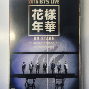 DVD cover for 2015 BTS LIVE: On Stage Japan Edition, featuring seven BTS members standing on a stage against a blue gradient background.