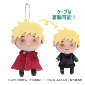 Two plush dolls of a blond boy shown side by side: one with a red cape, one without, illustrating that the cape is removable (Japanese text indicates detachable cape).