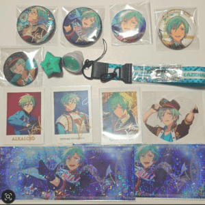 Assorted anime merch featuring a green-haired character: eight round pins, a turquoise star charm, a grey button, a teal lanyard, and trading cards with character art on a white surface.