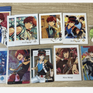Collection of Hiiro Amagi character cards laid out on a wooden table, showing multiple colorful designs.