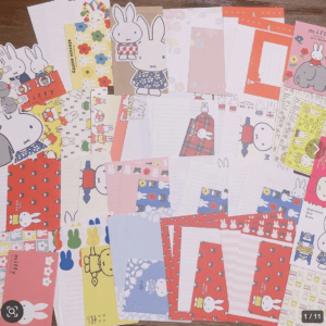 Collage of Miffy-themed stationery—notebooks, papers, and stickers in pastel colors with repeated rabbit illustrations.