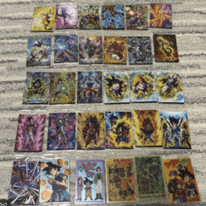Collection of Dragon Ball trading cards arranged in rows on a gray rug surface