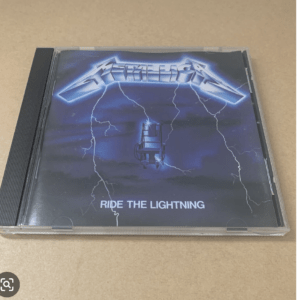 CD case with Metallica's Ride the Lightning cover, featuring blue lightning bolts and a central electric chair image.
