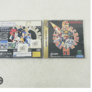 Two Sega CD game cases side by side on a pale surface; left case shows anime-style characters with Japanese text, right case features Guardian Heroes cover.  Articulos Japan (Post Box Japan)