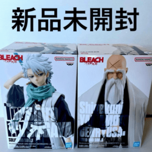 Two Bleach action figure boxes, featuring Toshiro Hitsugaya on the left and Genryūsai Shigekuni Yamamoto on the right, both new and unopened in their packaging.