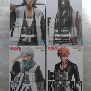 Four Bleach character action figure boxes arranged in a 2x2 grid on a metallic surface, each box showing a different character portrait and bold title text.