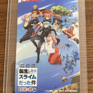 Colorful anime card showing a group of characters leaping mid-air against a blue sky, with Japanese title text in the bottom-left.