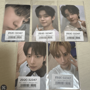 Six glossy photo cards laid out on a table, each with a barcode label reading ZD2C-32347 and a selfie-style portrait of a young man making a peace sign or posing.