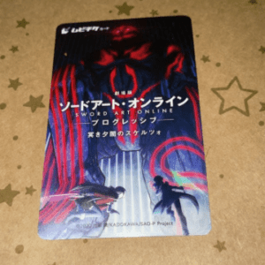 Promotional card for Sword Art Online showing a neon-lit battle scene with two warriors and Japanese title text.