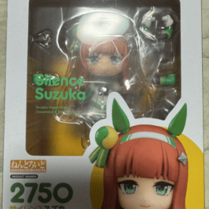 Boxed Nendoroid figure of Silence Suzuka in a window display, showing the chibi orange-haired character in a green-and-white outfit; packaging lists 'Silence Suzuka', model 2750, Good Smile Company.