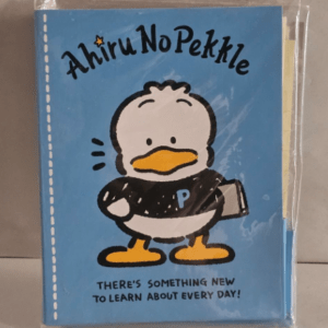 Blue notebook cover with a cartoon penguin holding a book, title 'Ahiru No Pekkle' and the slogan 'There’s something new to learn about every day!'