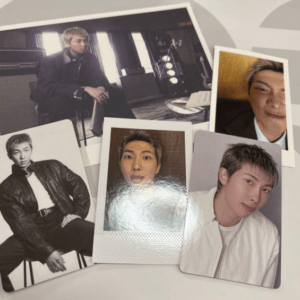 Collage of five photos of a young man in different outfits laid on a light surface with studio elements in the background.