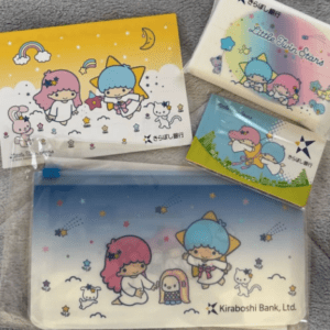 Little Twin Stars-themed stationery set with envelopes, a zip pouch, and cards in pastel colors featuring stars, clouds, and Kiraboshi Bank branding.