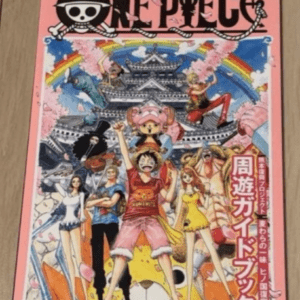 One Piece manga cover: pink border, characters posing in front of a castle with cherry blossoms and a rainbow behind them.
