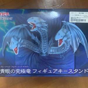Box packaging for a Blue-Eyes Ultimate Dragon figure stand featuring a three-headed blue dragon artwork on the front