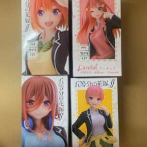 Four Coreful figure boxes arranged in a 2x2 grid, each with a different anime girl character and colorful packaging.  Articulos Japan (Post Box Japan)