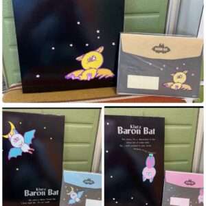 Black posters with colorful Baron Bat cartoon characters against a starry night, featuring the Klutz Baron Bat branding and small pink stars.