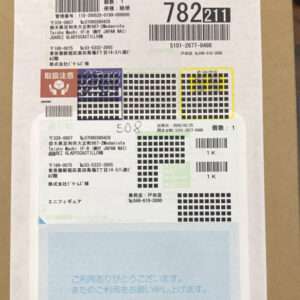 Shipping label on a cardboard box with multiple barcodes, Japanese text, and a blue Sagawa section at the bottom.