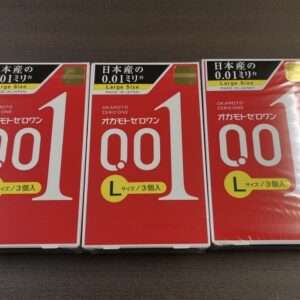 Three red Okamoto Zero One condom boxes showing size L on a dark surface.
