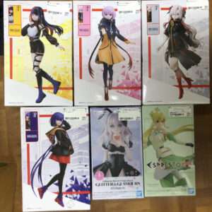 Six boxed anime figures laid out on a wooden floor, each with colorful outfits and stylized poses.