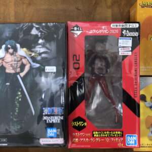 Black box with muscular anime figure holding a sword on cover; Bandai logo, Japanese text on left edge (MasterlisE ExPiece).