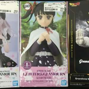 Three boxed anime figures on a shelf: left box shows Alya Bunny ver. Glitter & Glamours in a black bunny suit; middle box shows Kamado Tsuyuri in a cape; right box shows Grandista Dragon Ball Z Vegeta in a blue outfit in a dynamic pose.