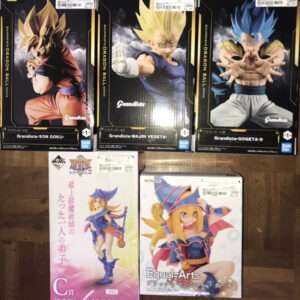 Three Dragon Ball Z Grandista figures in boxes: Goku, Majin Vegeta, and Gogeta II, lined up on a wooden surface. Also shows two Equal=Arts figures of anime girls on the bottom row.  Articulos Japan (Post Box Japan)