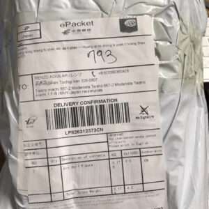 Padded parcel with an ePacket delivery label, barcode, and handwritten number visible on a light-gray mailer.