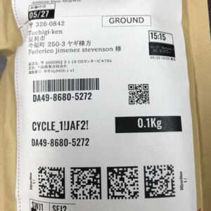 Shipping label on a package: destination in Tochigi, ground shipment, 0.1 kg, with barcodes and QR codes.