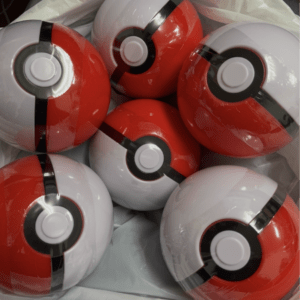 Pile of red-and-white Poké Balls in a white plastic bag on display.