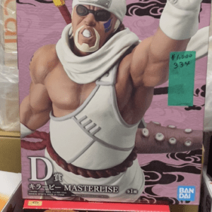 Stack of anime figure boxes on a store shelf, top box shows Jujutsu Kaisen with blue silhouette and a green price tag