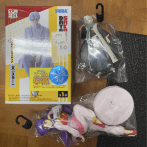 Boxed anime figure set with a tall pale-haired character on the cover and a yellow red design, labeled SEGA DAYS.