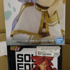 Two boxed anime figures stacked: top box shows an elf girl with purple hair and green eyes in white and gold outfit; bottom box features a Dragon Ball GT Solid Edge Works figure with a red-haired character.