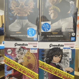 Shelf display of four boxed Grandista Dragon Ball figures: two Gogeta boxes on top, two other characters on bottom, with price tags visible.
