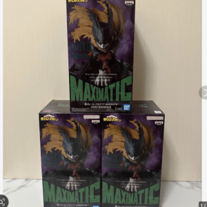 Stacks of Maximatic Izuku Midoriya figures boxes with bold green MAXIMATIC text, photographed on a light wall shelf.