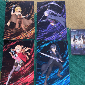 Four anime character posters in a 2x2 grid with swords, on a textured surface; a small anime card sits to the right.