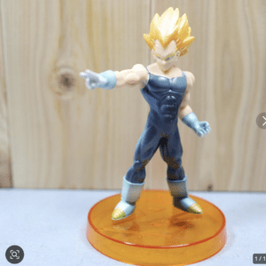 Action figure of a Super Saiyan character in a blue bodysuit, pointing forward on an orange base with spiky yellow hair.