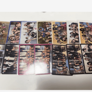 Assorted group photos arranged on a table, showing many people smiling in each card.