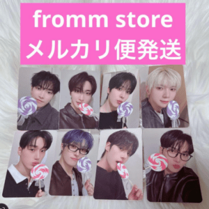 Nine K-pop photo cards in a grid, each member holding a color swirl lollipop; pink banner at top reads 'fromm store メルカリ便発送'