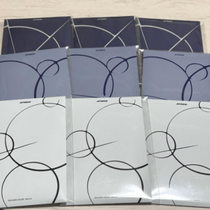 Nine notebooks arranged in a 3x3 grid, featuring abstract circular line artwork on blue, lavender, and white covers; white covers include the text 'GOLDEN HOUR: Part 4'.