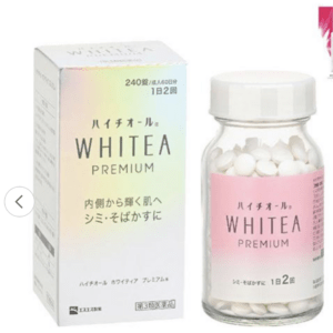 Bottle of WHITEA PREMIUM dietary supplement with white pills beside a pastel gradient box (Japanese text). It conveys a beauty/skin support product.