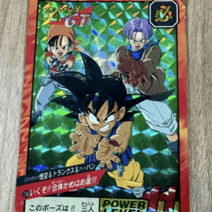 Holographic Dragon Ball GT trading card with Goku in front reaching forward, and two other characters behind; red border and 'POWER LEVEL' indicators.