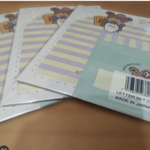 Three pastel letter-writing sheets featuring purple and yellow stripes, with a blue-green cover that reads 'Letter Set' and 'Made in Japan' (stationery set).